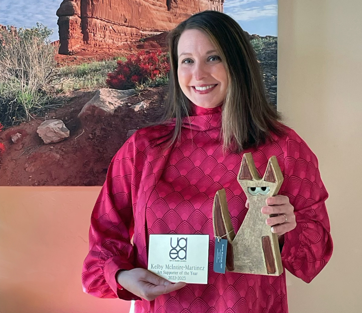 Associate Dean Kelby McIntyre-Martinez with her UAEA award (made by local Moab artist Shari Michaud)